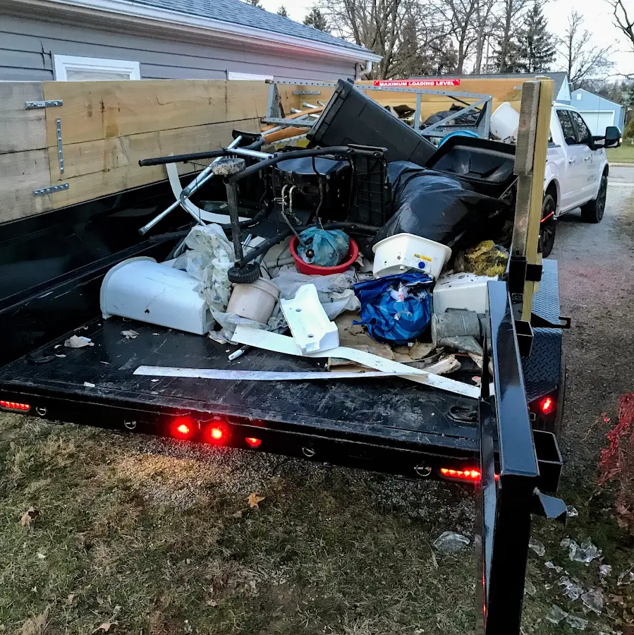 Roll-off dumpster delivered to a residential driveway in Maple Grove